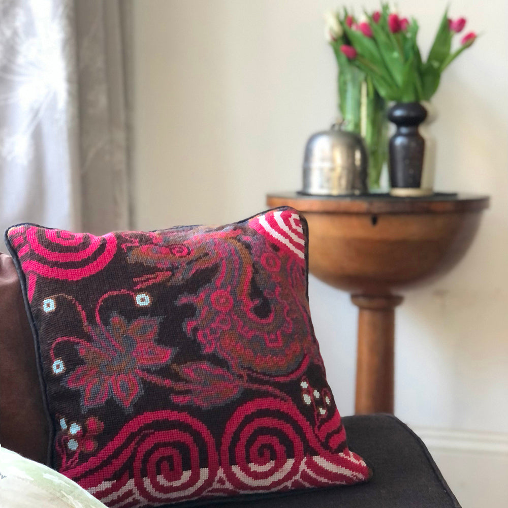 Tapestry cushion featuring the Royal Dragon in pink and chocolate colours.