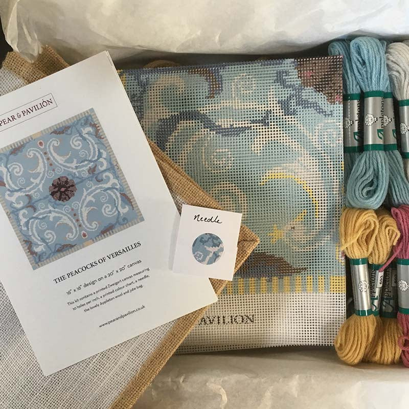 The Peacocks of Versailles tapestry kit in a blue colourway, showing inside the box.